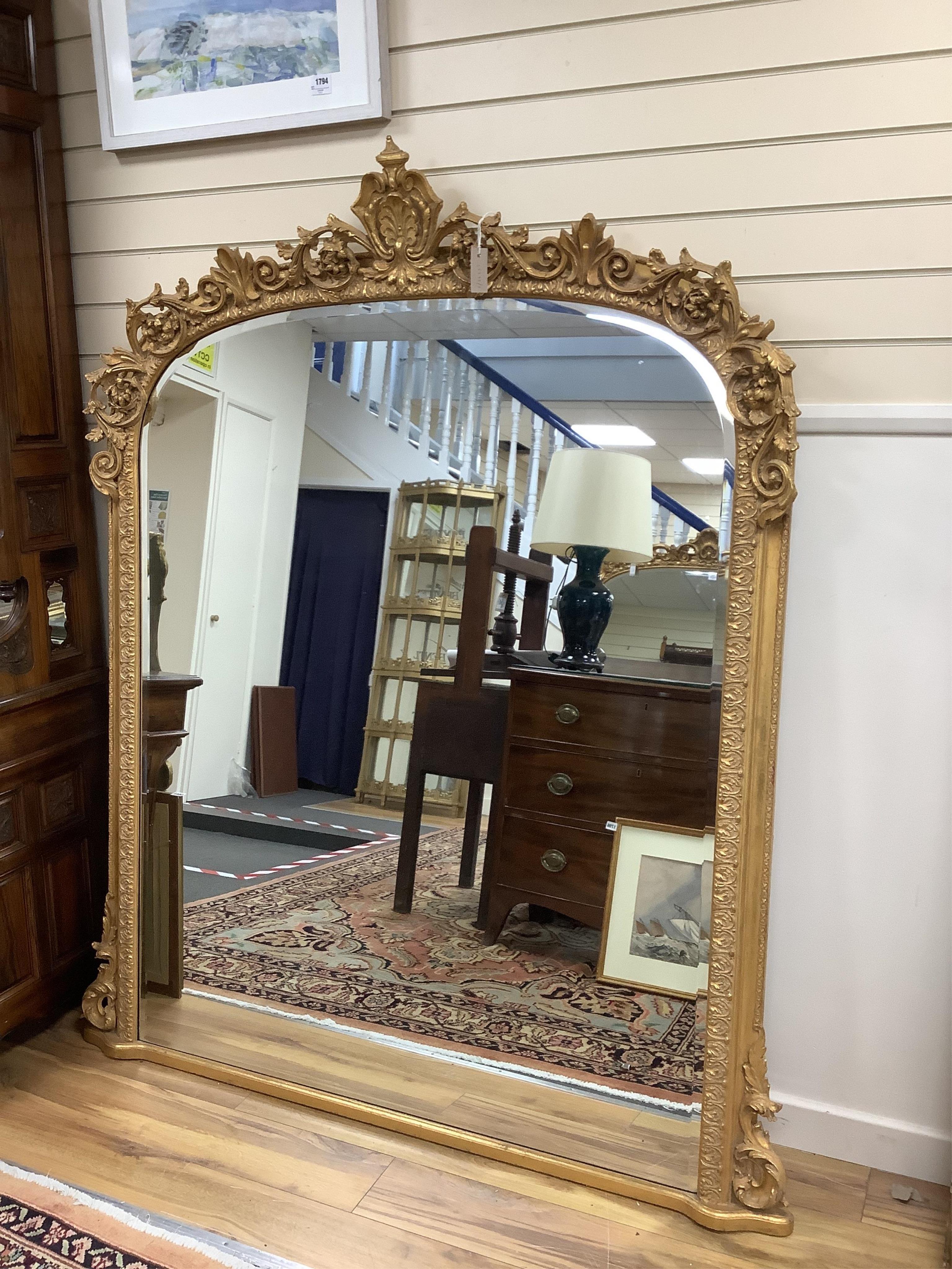 A Victorian style giltwood and composition overmantel mirror, width 138cm, height 180cm. Condition - good